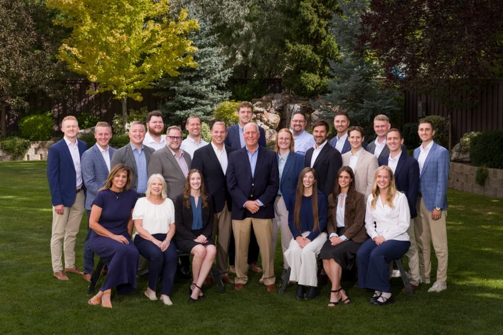 The Peterson Wealth Advisors team, standing together outdoors