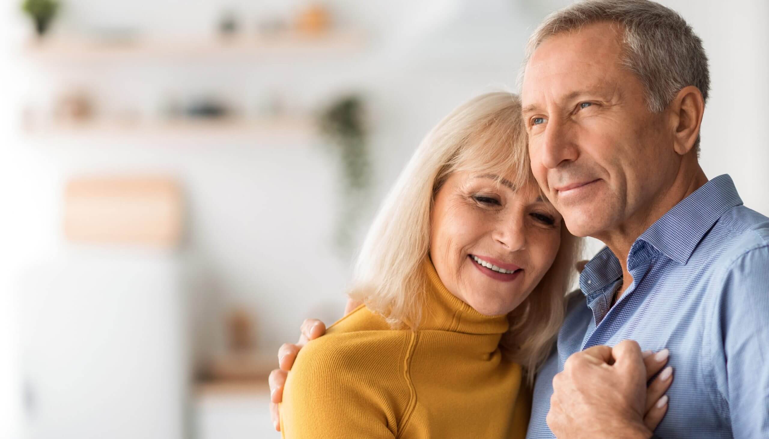 Happy loving, older couple, representing retirement planning by Peterson Wealth Advisors